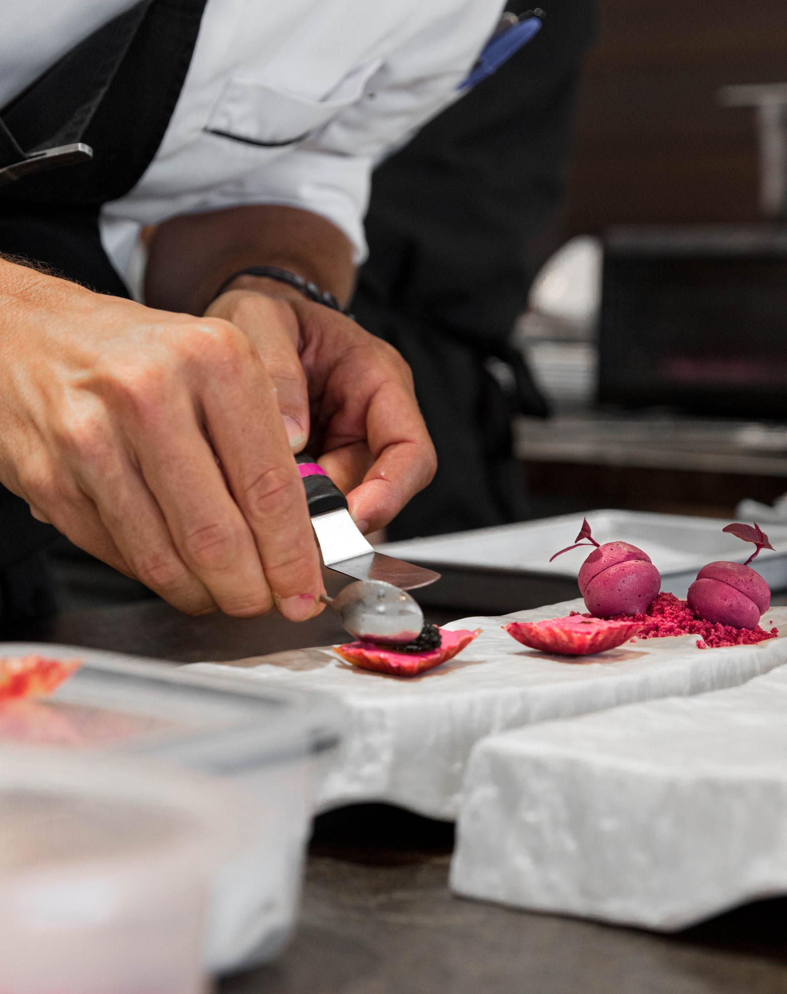 Instructor showing knife skills to small group